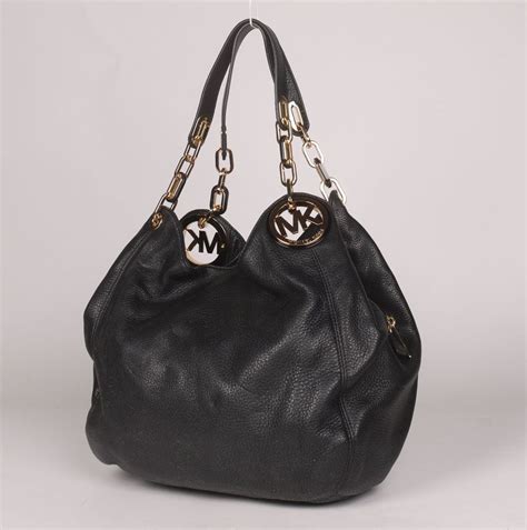 michael kors fulton large charm shoulder ba blackgold|Michael Kors shoulder bag.